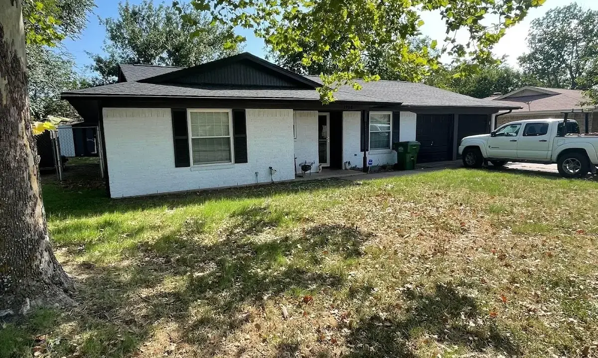 Professional roofing crew working on a residential roof in Steele Creek